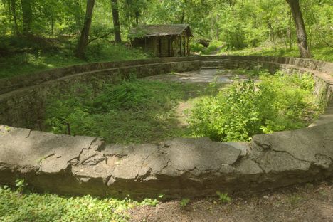Abandoned pool and pool hut.