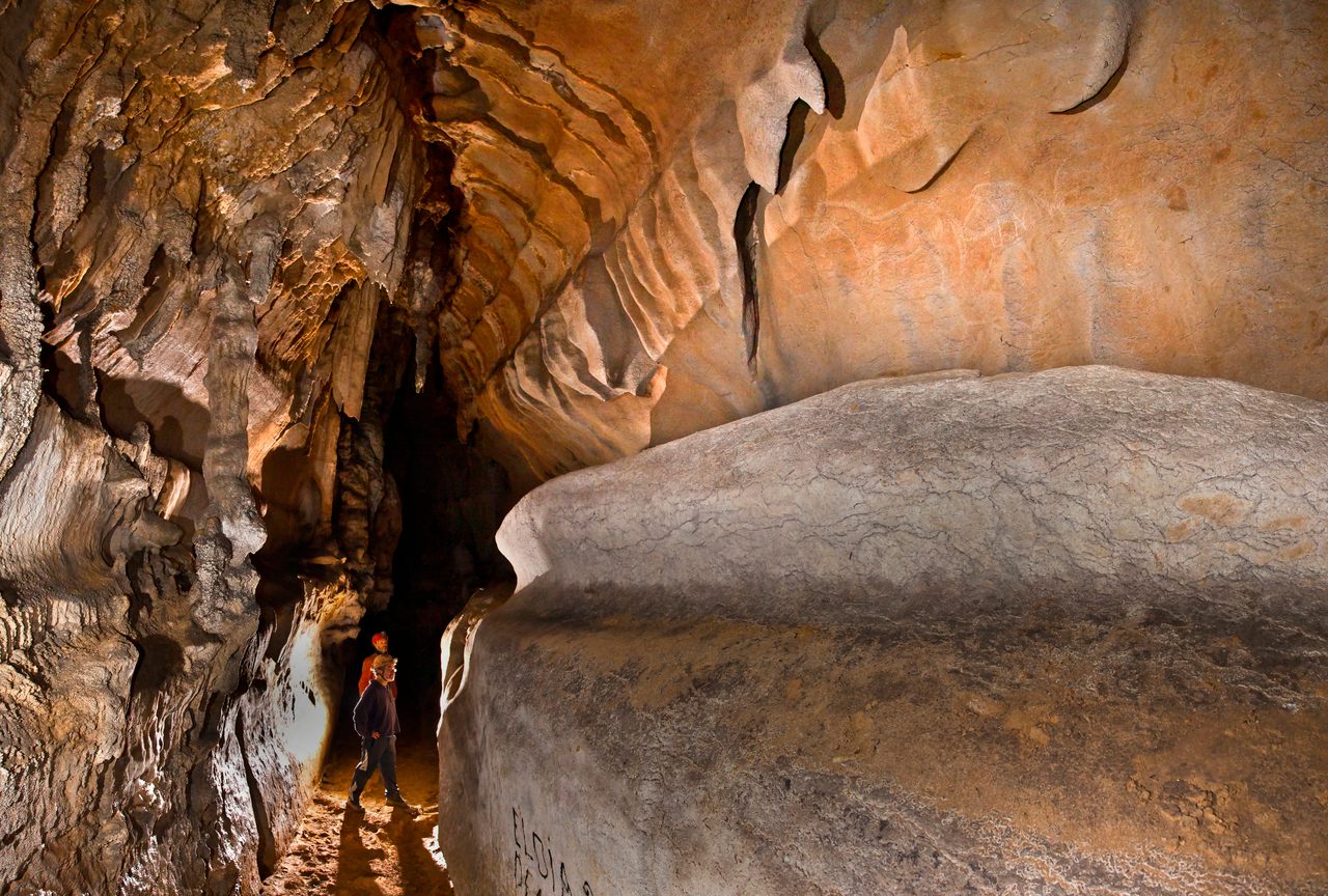 Nearly a quarter-mile into Spain's Atxurra Cave, Paleolithic people carved scores of animals on a wall eight feet above the cave floor. It's now known as the Ledge of Horses.