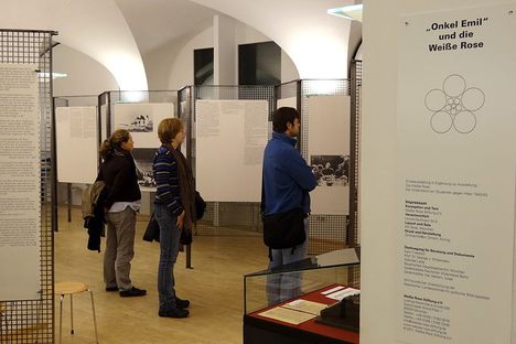 Visitors viewing exhibits in the White Rose memorial exhibition.