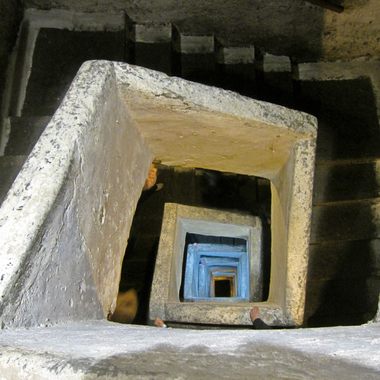 A staircase excavated from the tuff leads to a depth of 120 feet (40 meters).