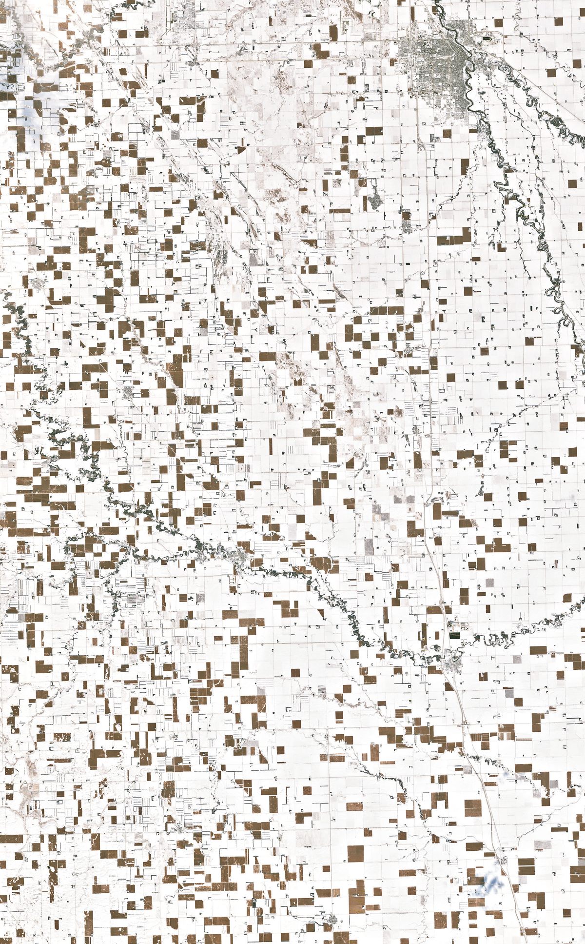 This view of North Dakota corn fields comes from the Landsat 7 satellite, which orbits the Earth at an altitude of 438 miles.