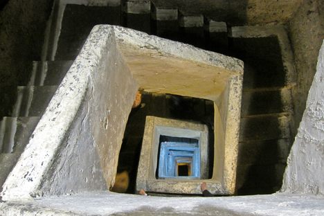 A staircase excavated from the tuff leads to a depth of 120 feet (40 meters).