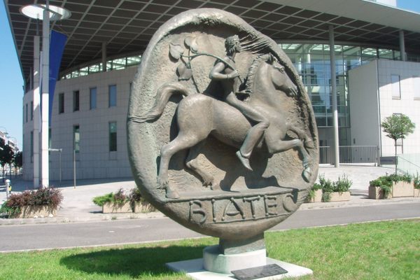 The monument in front of the National Bank building.