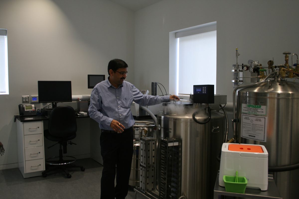Shukla uncaps the cryopreservation freezer.