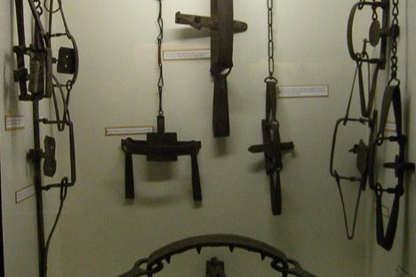 19th-century traps hang on display. 