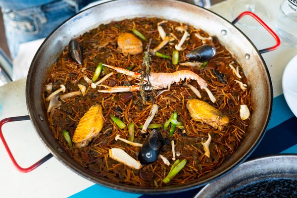 Fideuà, a close cousin of paella made with noodles, is a specialty here.