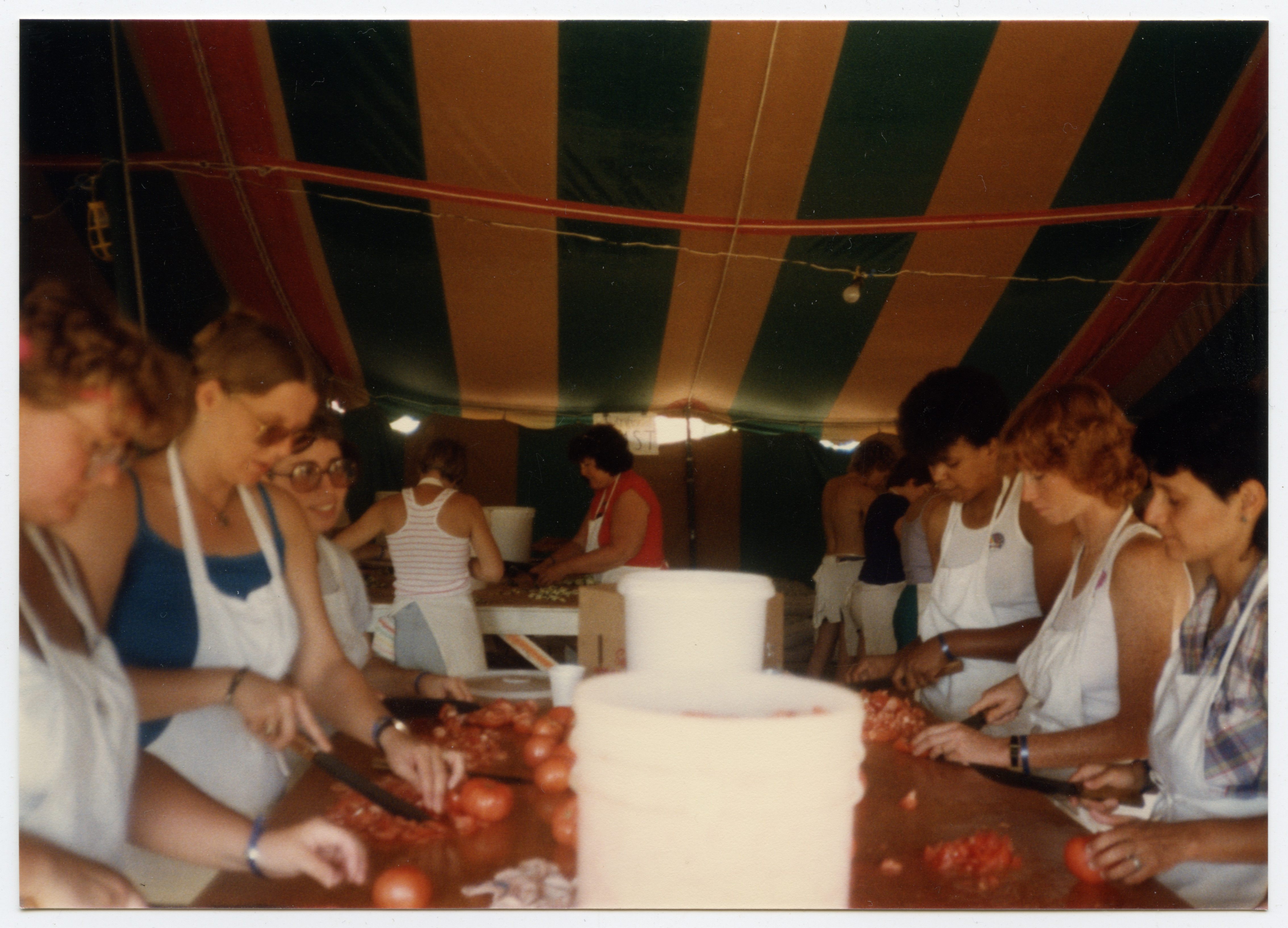 Women cooking at the Michigan Womyn's Music Festival, 1985.