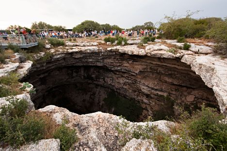 A crowd gathered to watch bats emerge from the Devil's sinkhole.