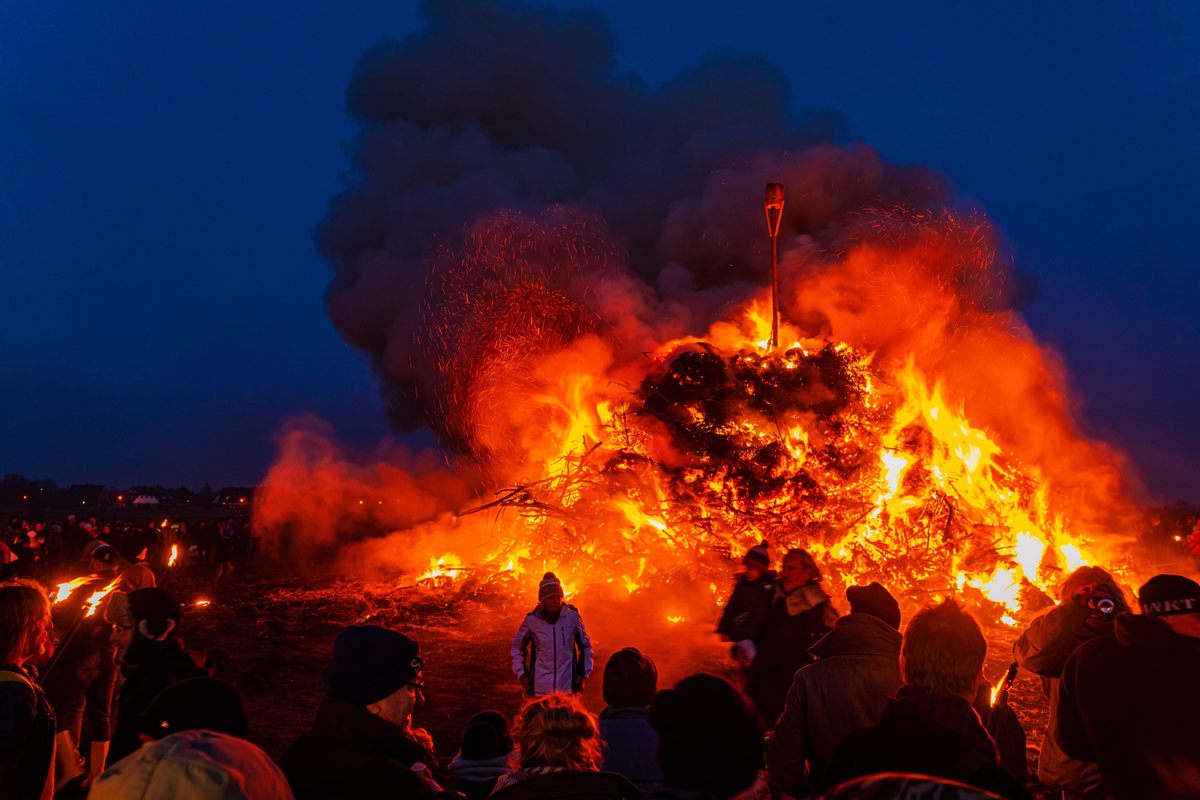 Residents of Sylt Island, North Frisia, Germany, drive out winter with a massive bonfire, which traditionally also served as a send-off for whaling crews. (2019)