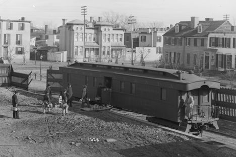 Workers carry Fearnow pails full of fish specimens to a United States Fish Commission Pennsylvania "Fish Car."