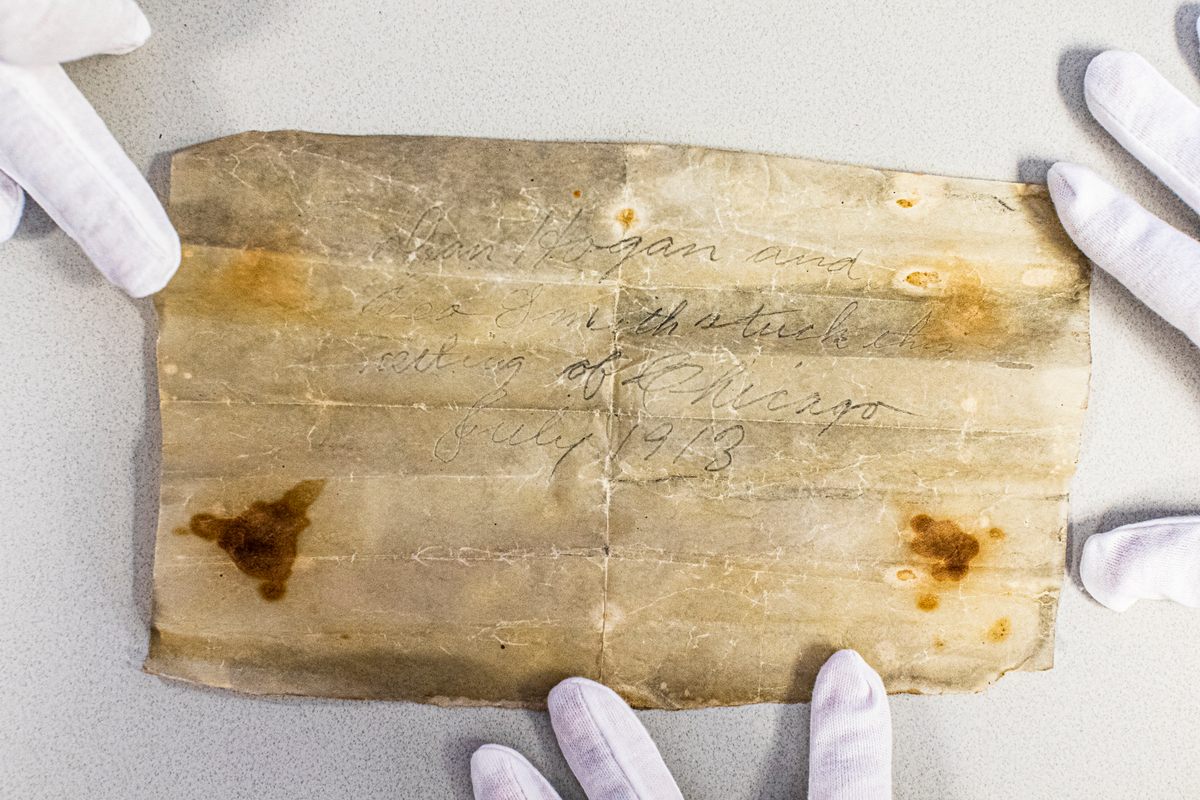 When archivists unrolled the paper, they discovered a message, but it didn't say much.