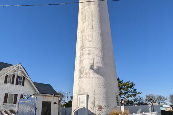 Transpeninsular Line historical sign and lighthouse