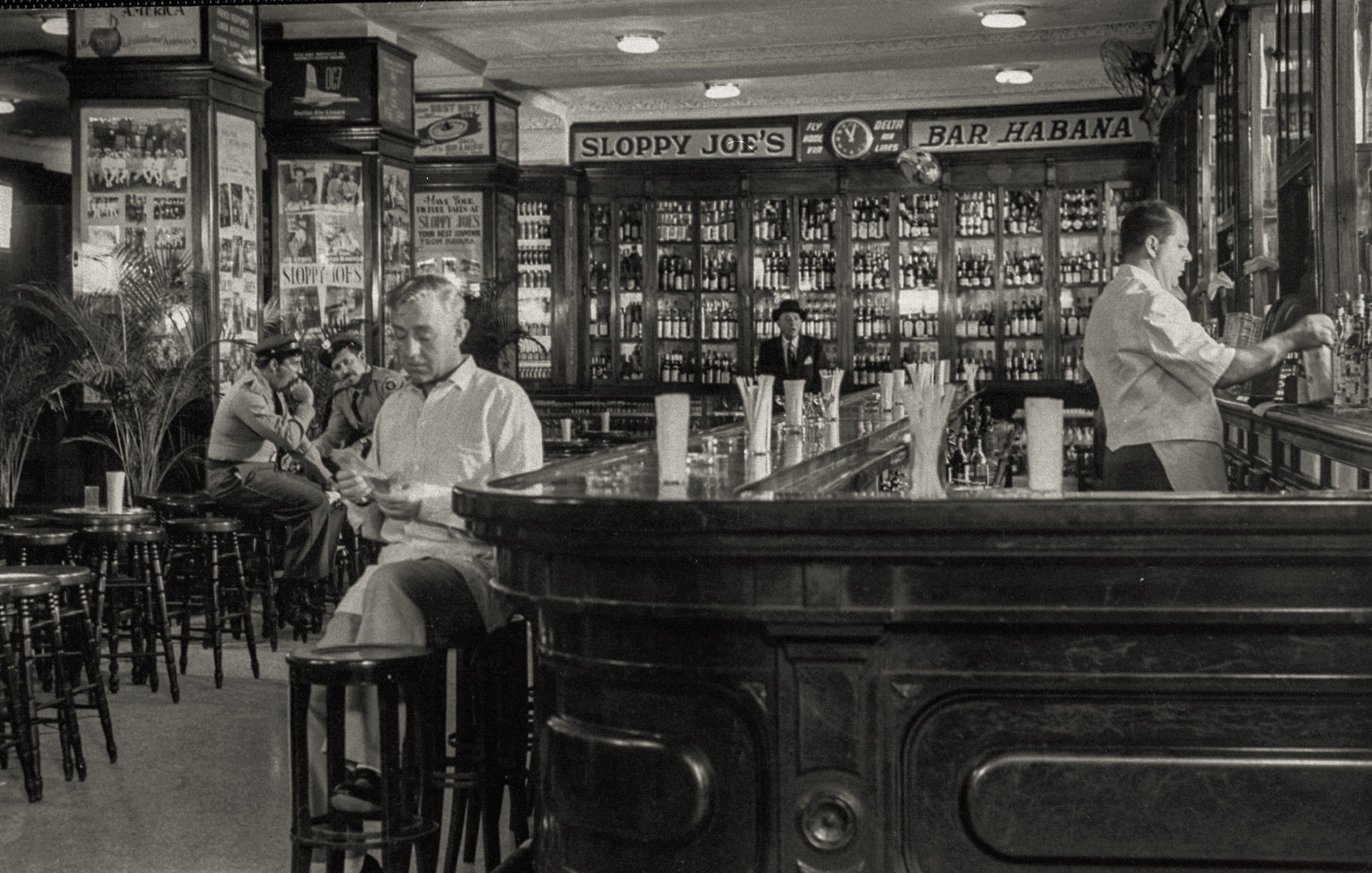 Alec Guinness at Sloppy Joe's bar while filming "Our Man in Havana."
