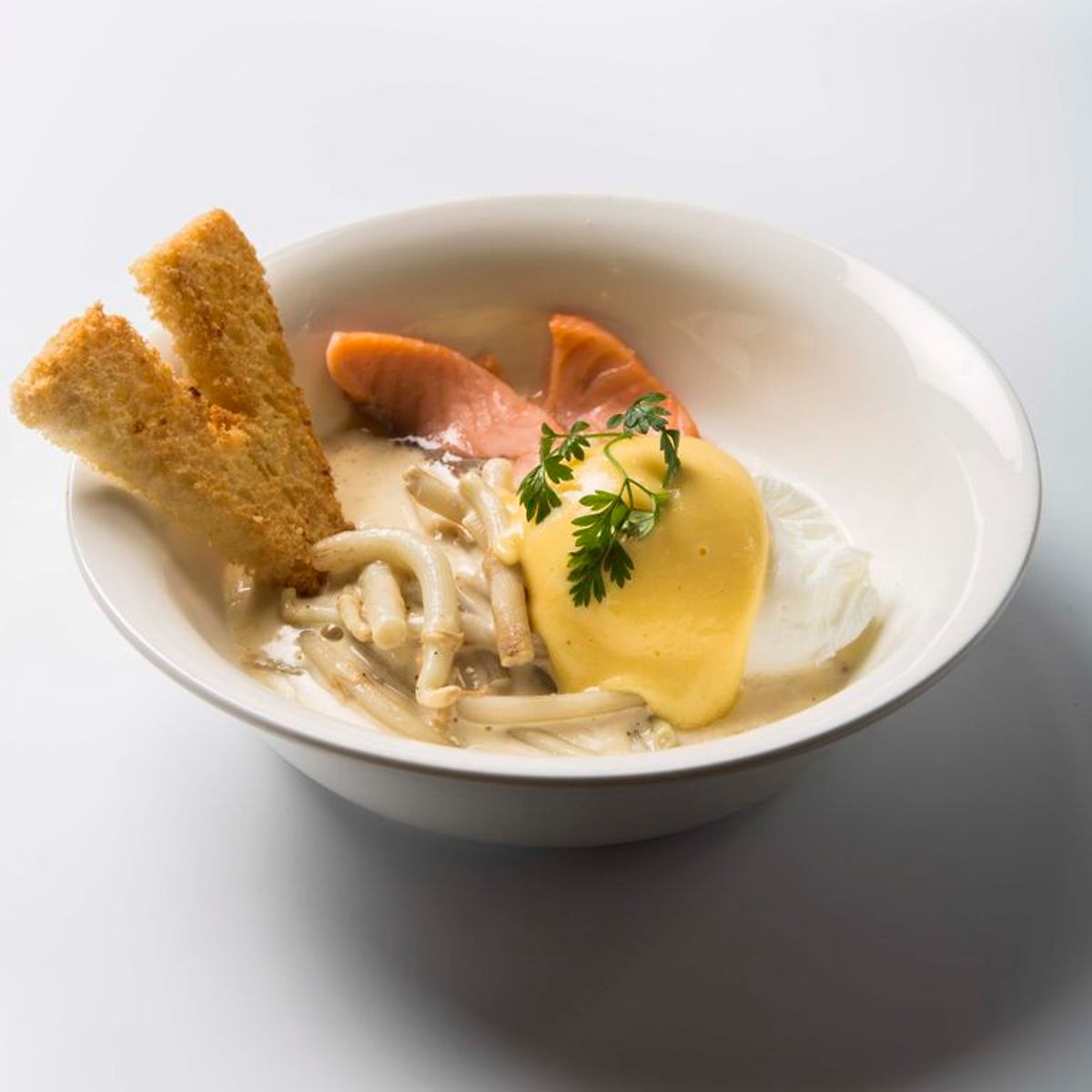 This Belgian preparation pairs hops shoots with poached eggs and salmon in creamy sauce.