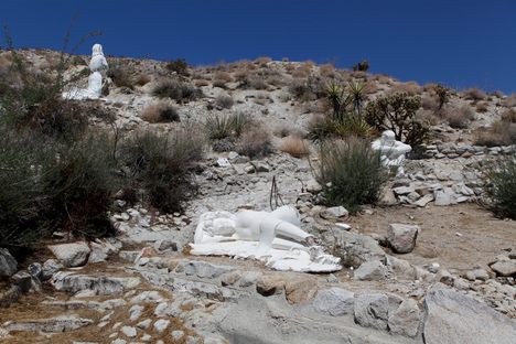 Biblical figure relaxing in the garden.