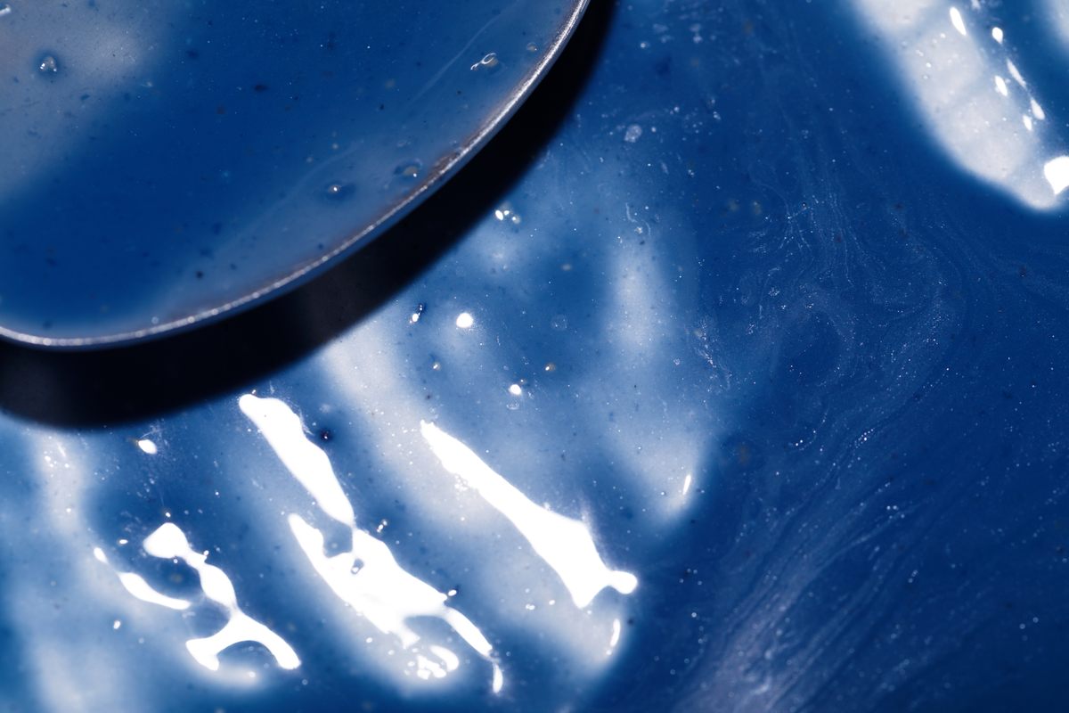 Costa's gleaming blue <em>crème anglaise</em> is a vivid take on a traditional dessert.