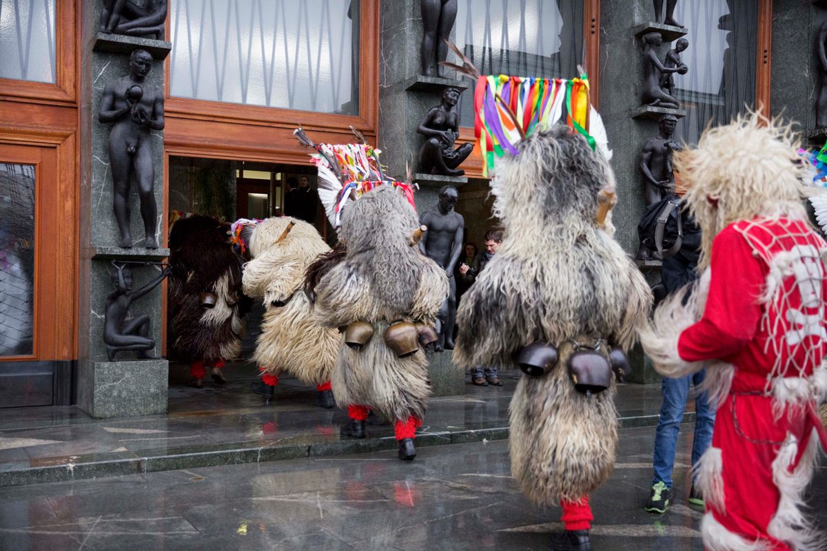 Kurenti enter the Slovene national parliament in the capital Ljubljana, as they do every year to bring good fortune and secure pledges of government support for festivities. 