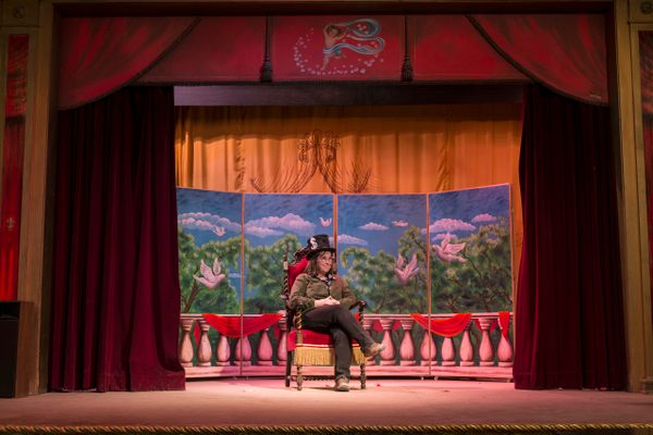 Carol Highsmith sits on the stage at Amargosa Opera House.