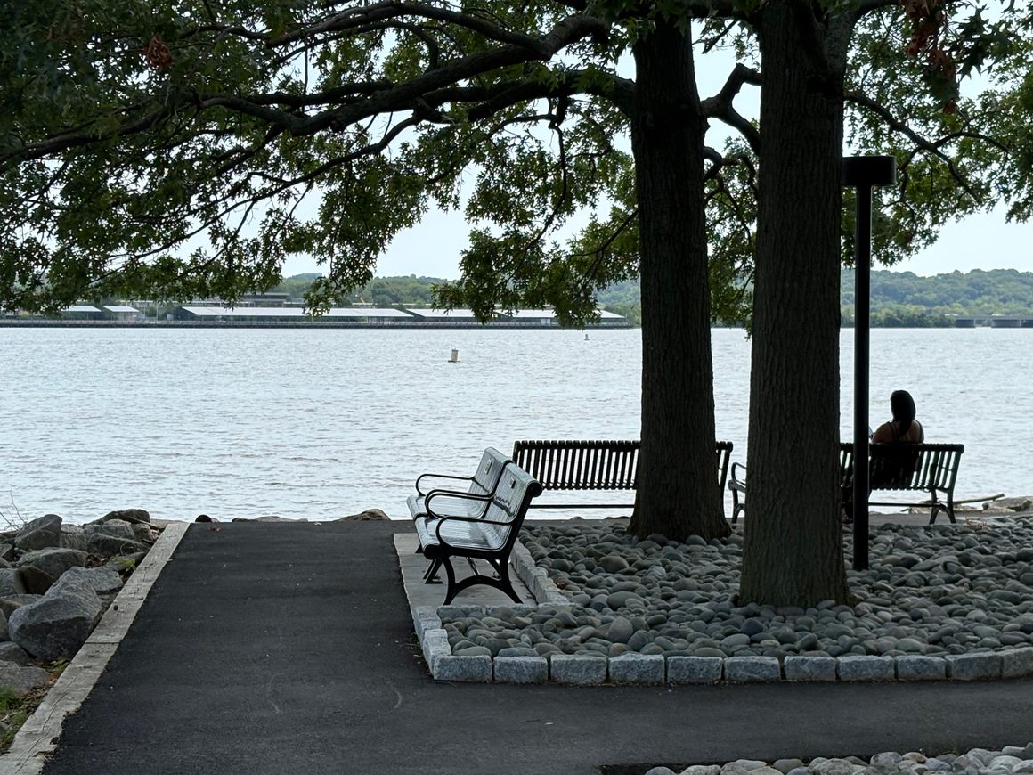 “The Potomac now provides a quiet backdrop to a site once crowded with boats, cargo, and waterfront labor.”