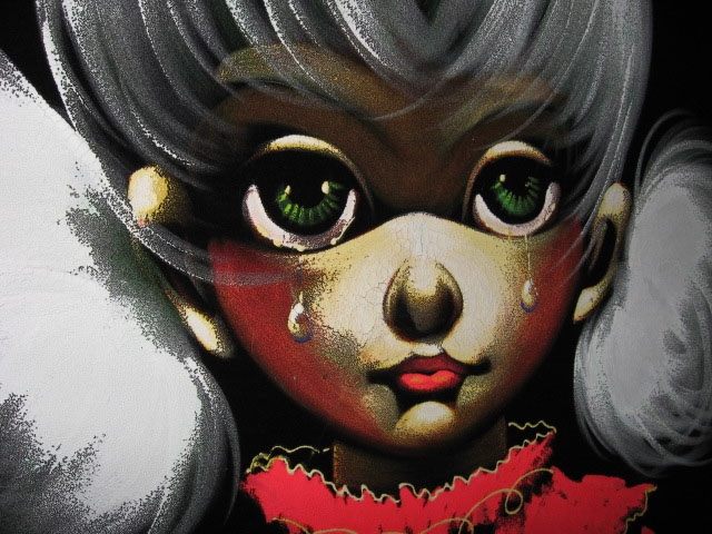 A detail of a velvet painting.