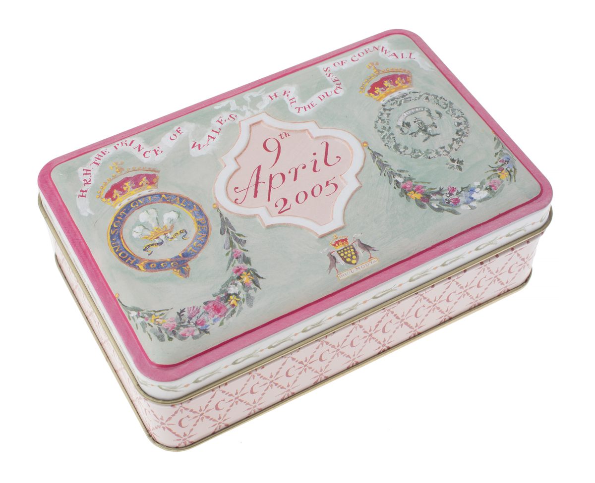 The wedding cake of the Prince of Wales and the Duchess of Cornwall, ensconced in a neat tin.