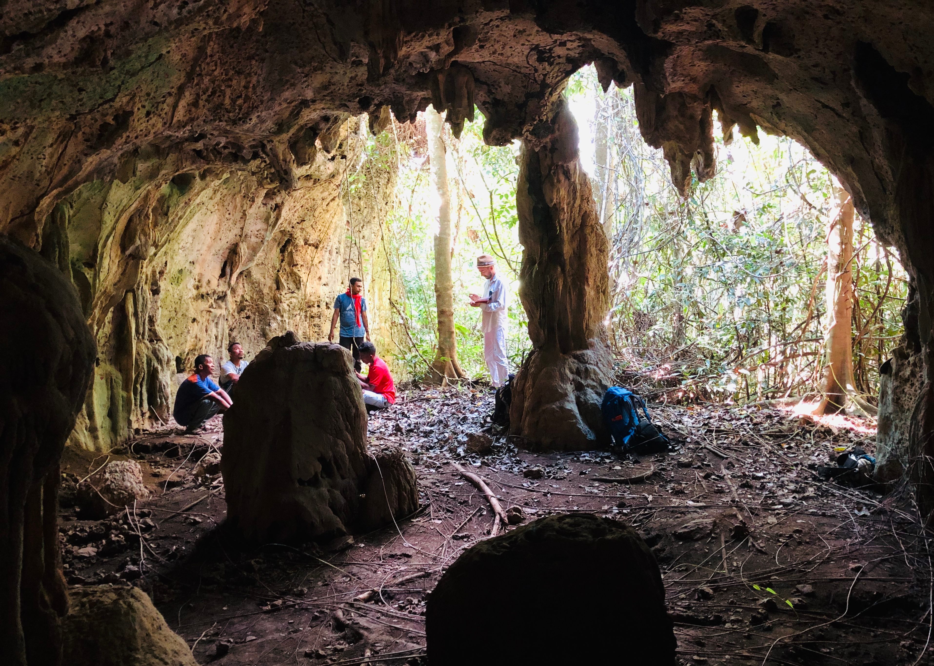 An Australian Research Council team surveys an archaeological site on the southern coast of the island of Seram in 2019.