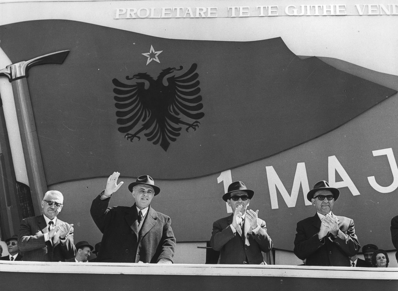 Communist officials from the ruling Albanian Party of Labour including Enver Hoxha, 2nd from left, wave and clap during national celebrations, 1973.