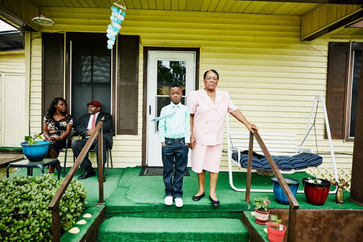 A boy and his grandmother on a porch on Texas's Gulf Shore.