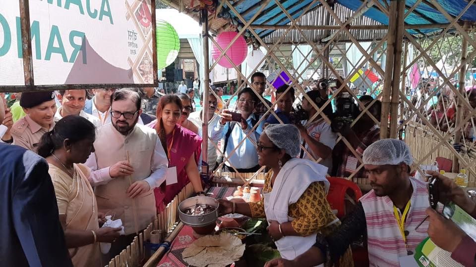 Jharkhand state government officials visit Ajam Emba's stall at the annual Dumka bamboo festival. 