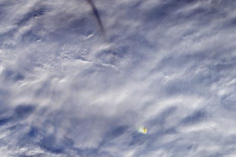 The shadow of the meteor's trail (about 100 miles long), and the hot air glowing in its wake.