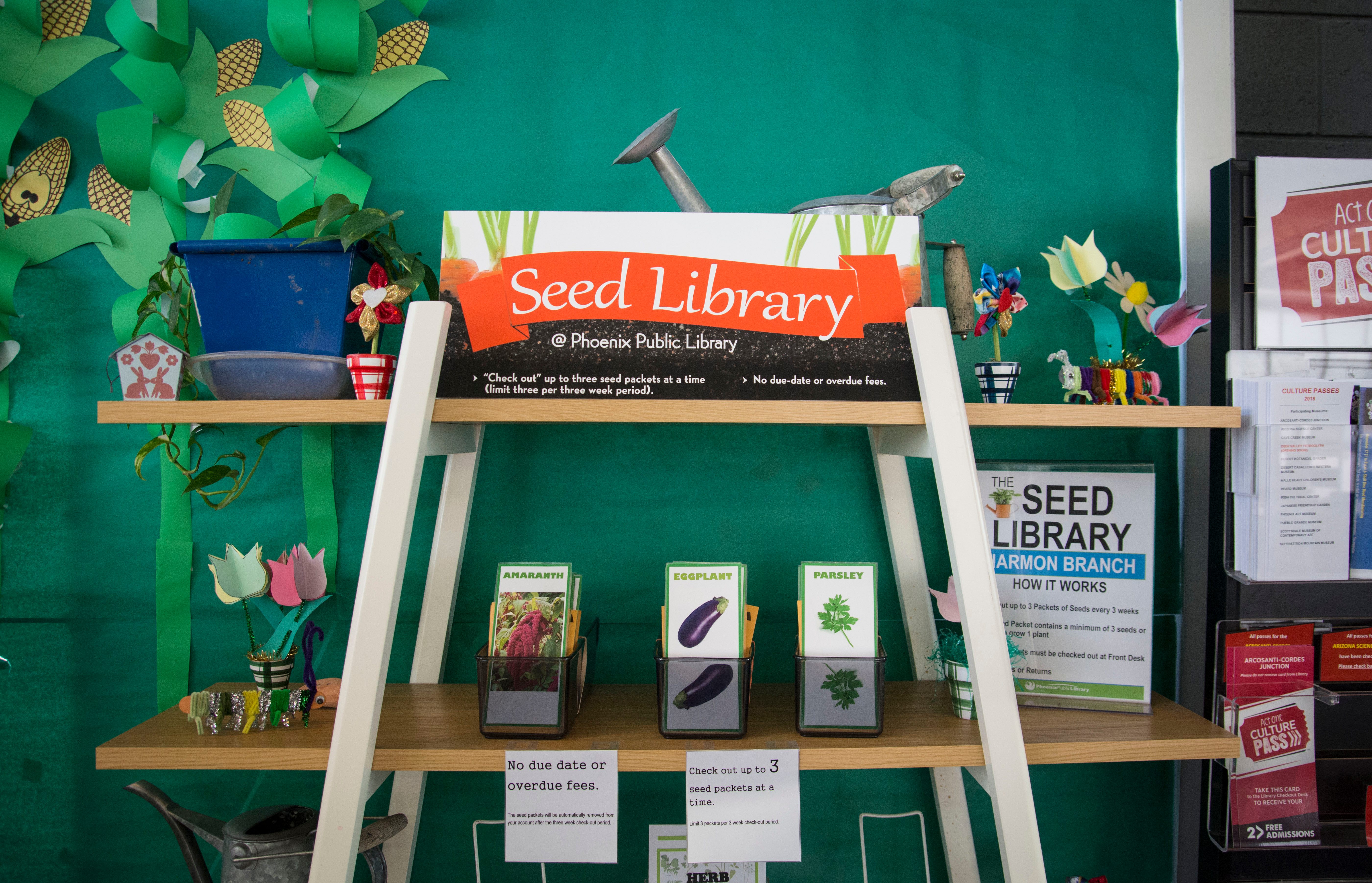 A shelf in the Harmon branch of the Phoenix Public Library displays seeds available to check out.