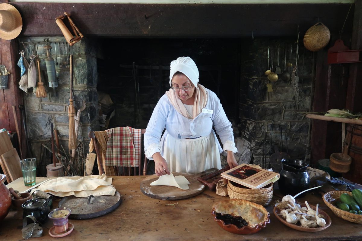 Nancy Schmeichel works in the Landis Valley museum's tavern, with her finished raisin pie.