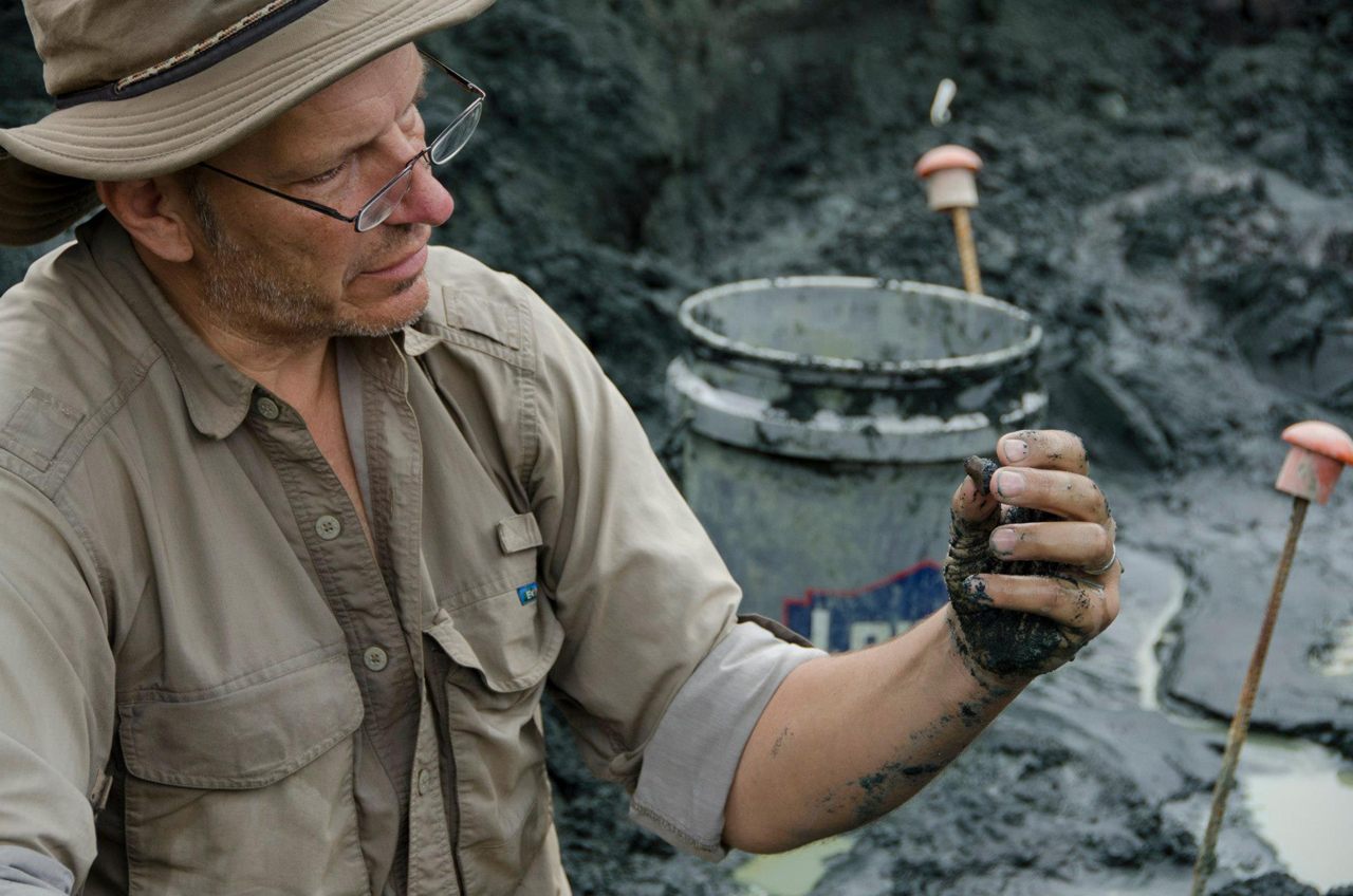 Paleontologist Ken Lacovara excavating in Mantua Township. 