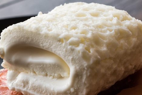 Kaymak atop a quince-based dessert.