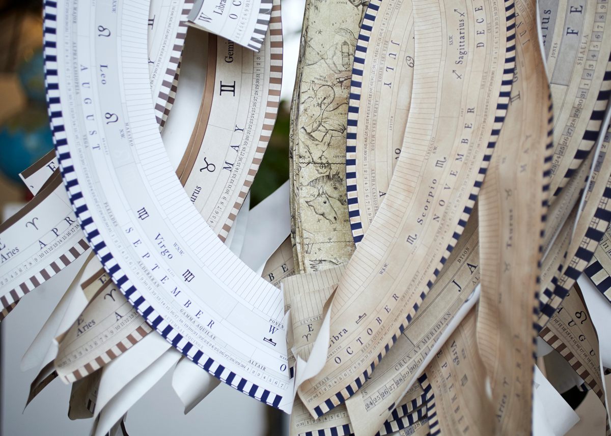 Horizon bands for the bases of floor standing terrestrial globes hang in the studio, photo by Tom Bunning.