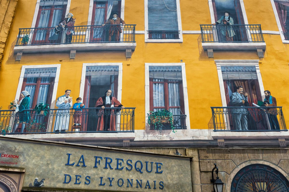 “La Fresque des Lyonnais,” one of the 150 murals that now decorate the city, pictures famous residents such as Antoine de Saint-Exupéry, author of <em>The Little Prince</em>, and the Lumière brothers, pioneers of cinematography.