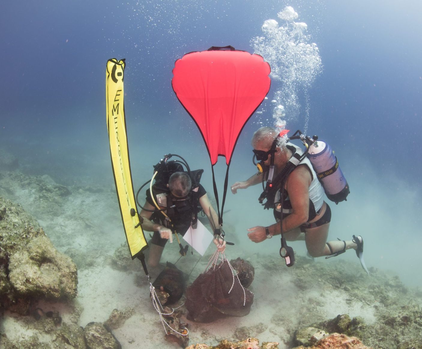 Marine archaeologists lifting ceramic finds with an airbag.