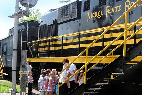 Visitors board a diesel locomotive.