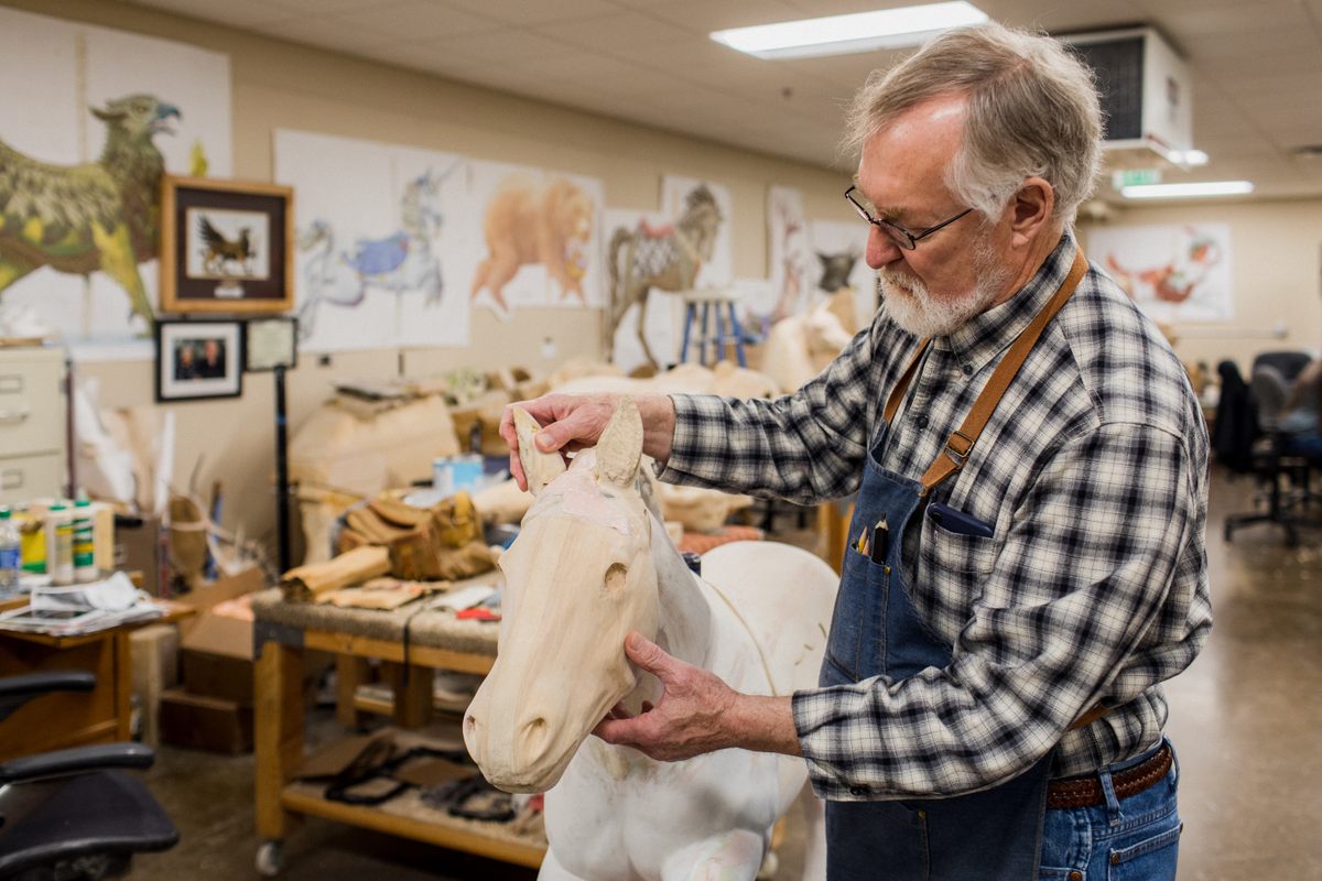As lead carver, Jack Giles trains the volunteers who will collectively spend an estimated 1,500 hours crafting each animal. Most have never carved anything before in their lives.