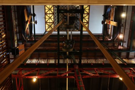 Leather belts running from the generator to the fans on the top floor.