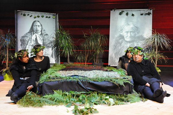 During a 2012 restitution ceremony at Quai Branly museum in Paris, black fabric and silver fern leaves cover 20 preserved Maori heads.