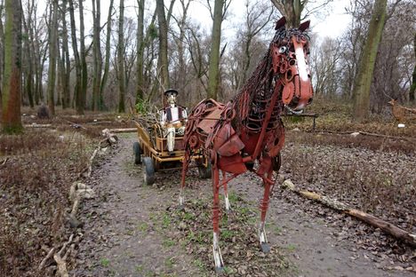 Coachman riding a horse