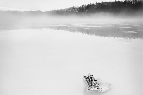 A Target bag rests on the surface of Walden Pond. Part of S.B. Walker's 2017 photo series, "Walden."