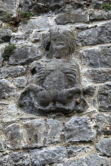 A weathered Sheela carved into a wall in Fethard, Ireland.