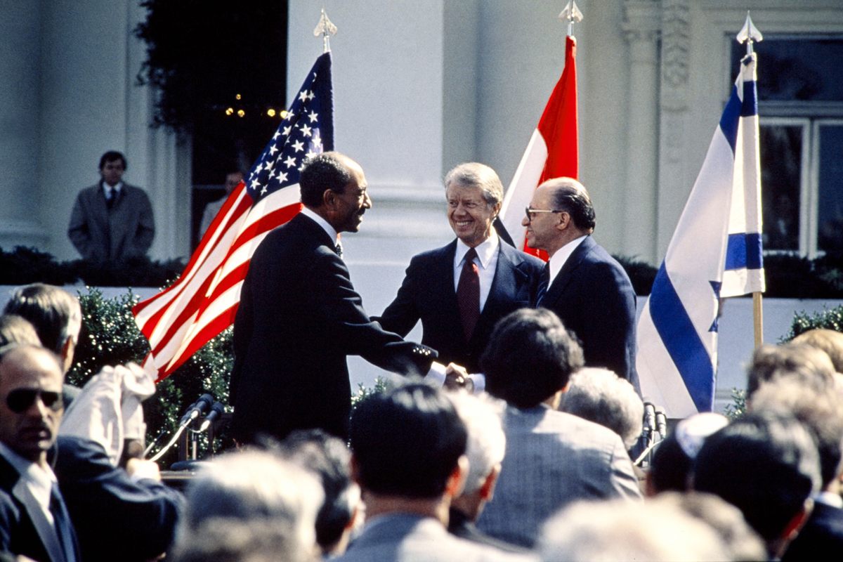 American President Jimmy Carter (center) with Egyptian President Anwar al-Sadat (left) and Israeli Premier Menachem Begin (right) after signing the 1979 peace treaty between Israel and Egypt.