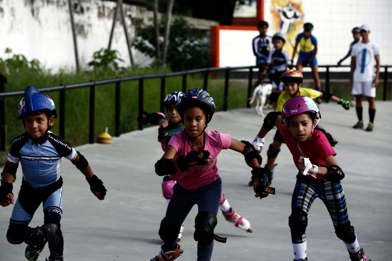 Children in Carabobo, Venezuela, participate in a state skating program. 
