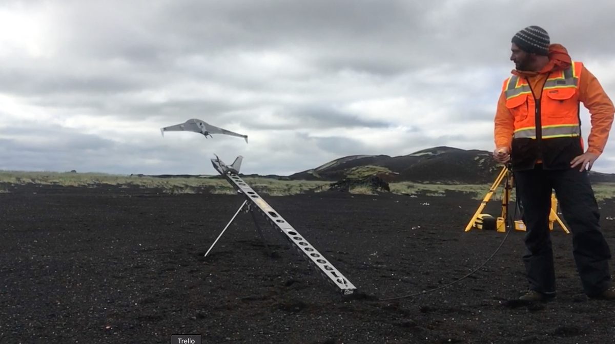 Hamilton launching a drone in Iceland.