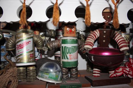 Bottlecap people lining the shelves on Walker's kitchen. 