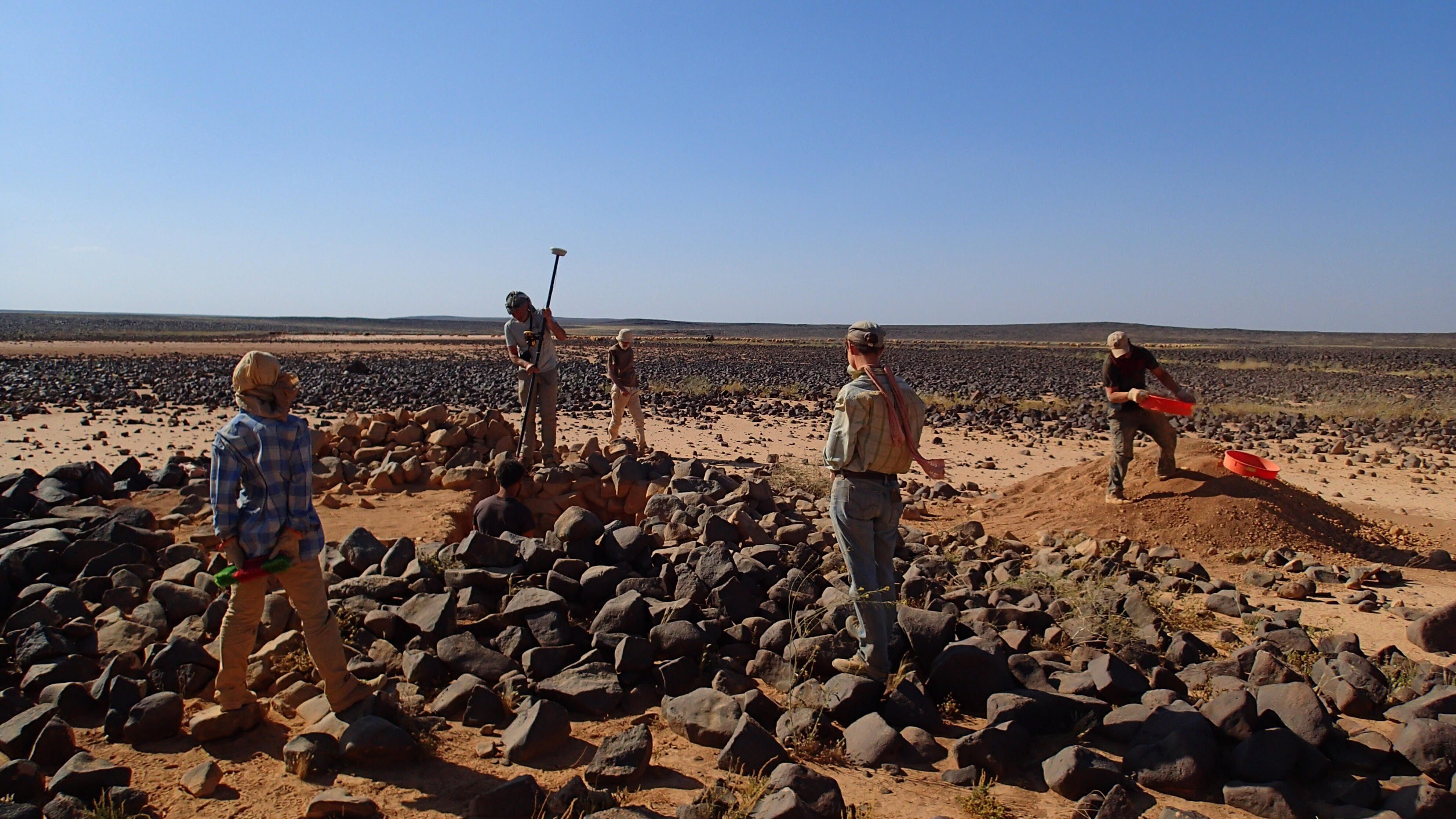 The Globalkites team working on the ground near a kite.