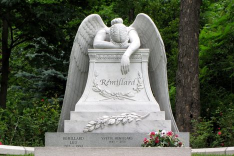One of the many headstones with statue
